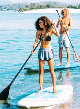 Stand-up paddleboarding off Naru Beach, Lake Macquarie